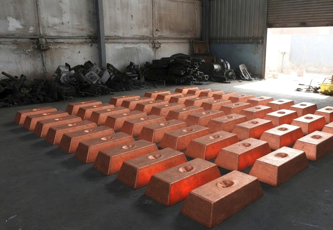 Rows of trapezoidal copper ingots on a shed floor
